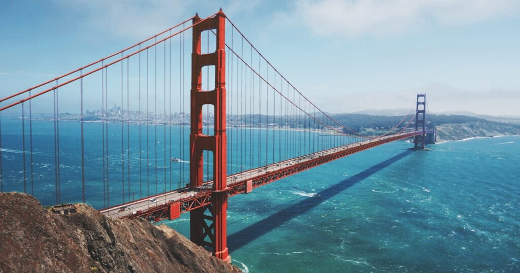 Golden Gate Bridge overlooking the Pacific Ocean with a clear blue sky